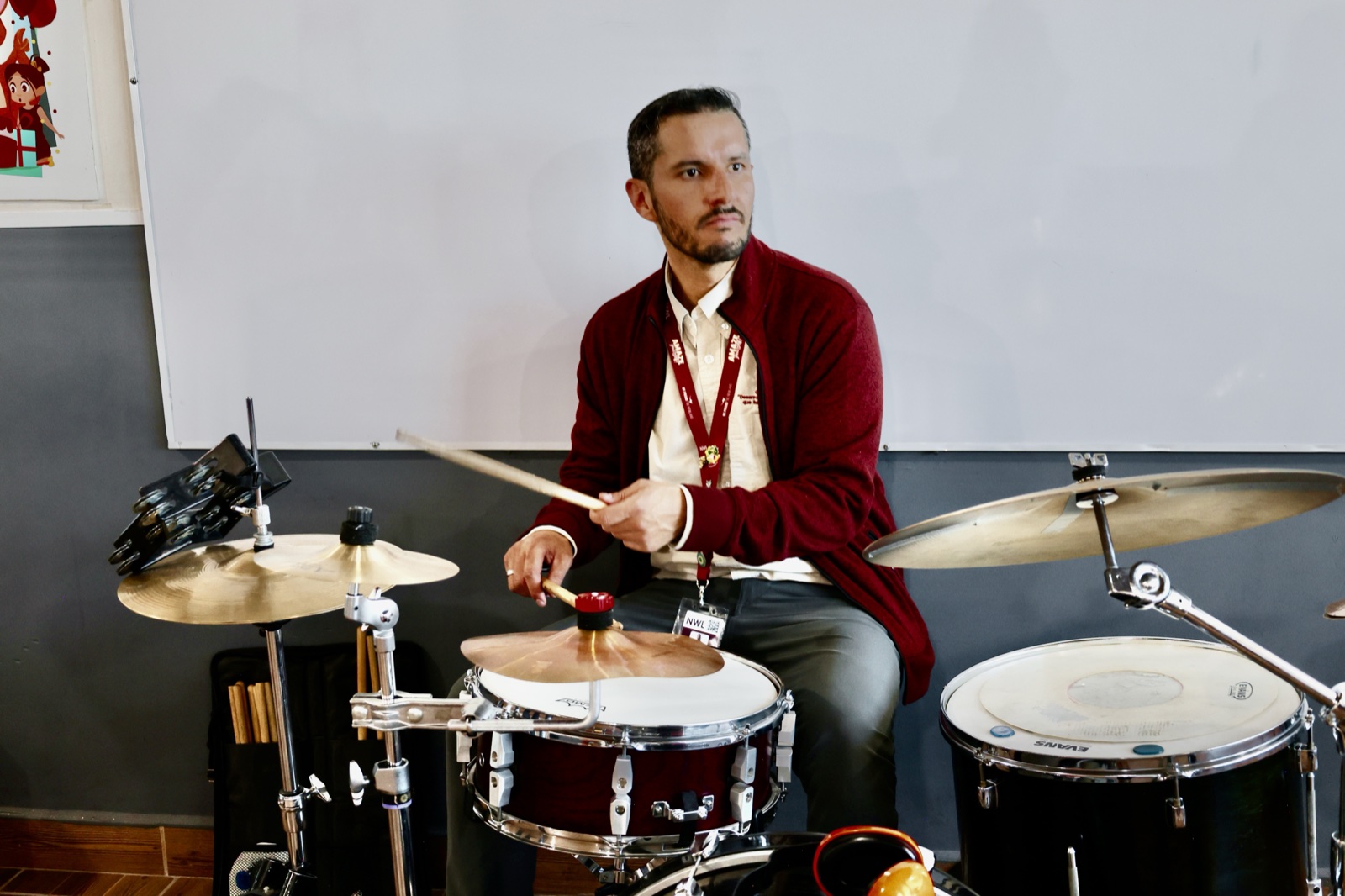 Music instructor playing drums
