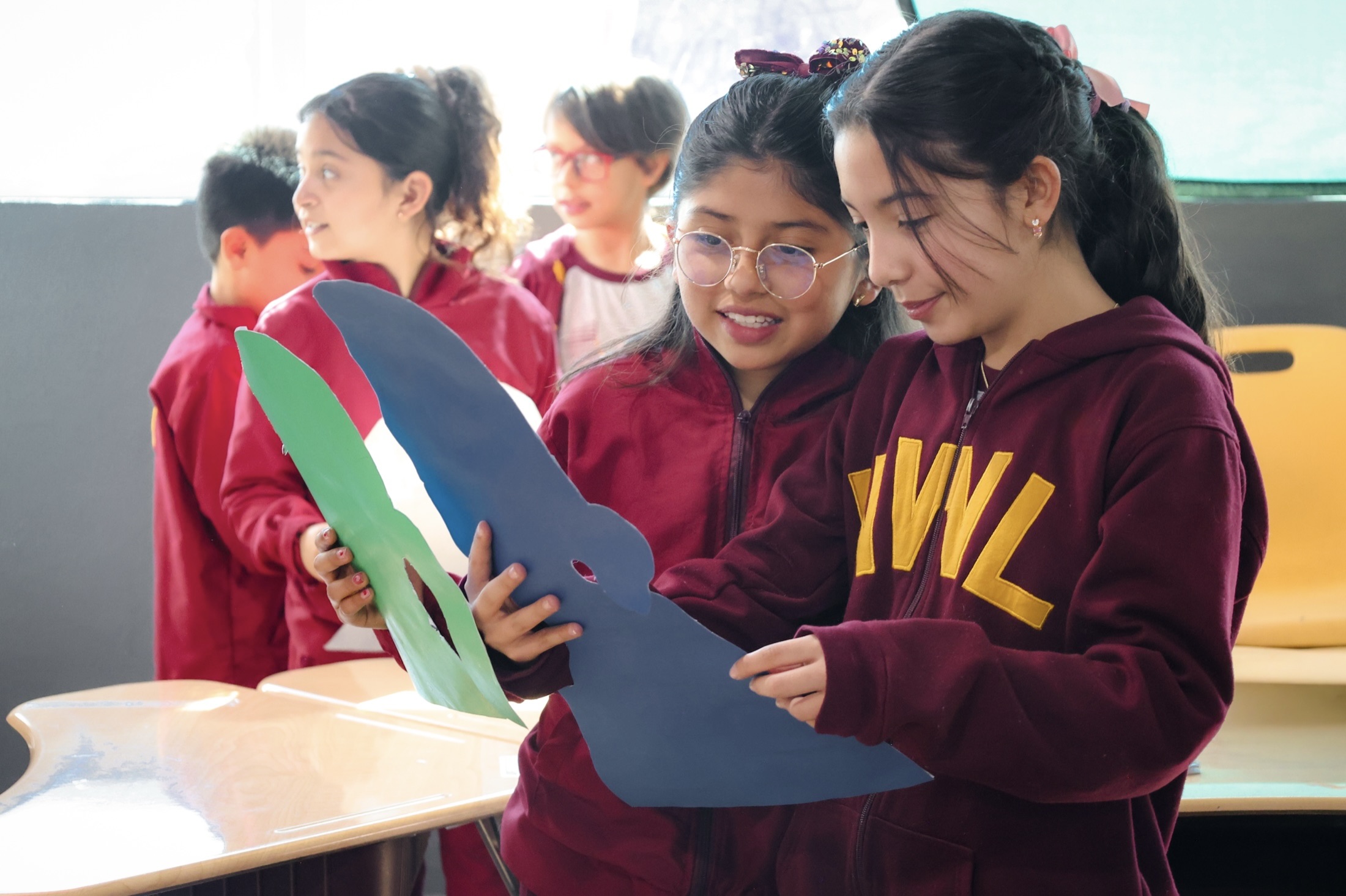 Newland Elementary art class with paper cutting and creative projects